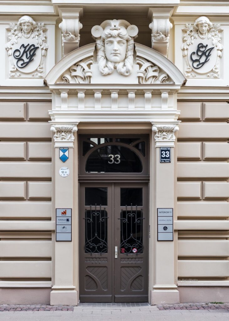 Close-up of decorative mascarons and mythological figures in Riga's Quiet Centre