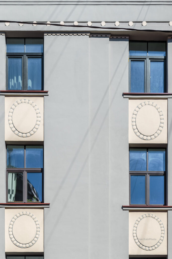 Ethnographic sun ornaments on Lāčplēša 51 facade